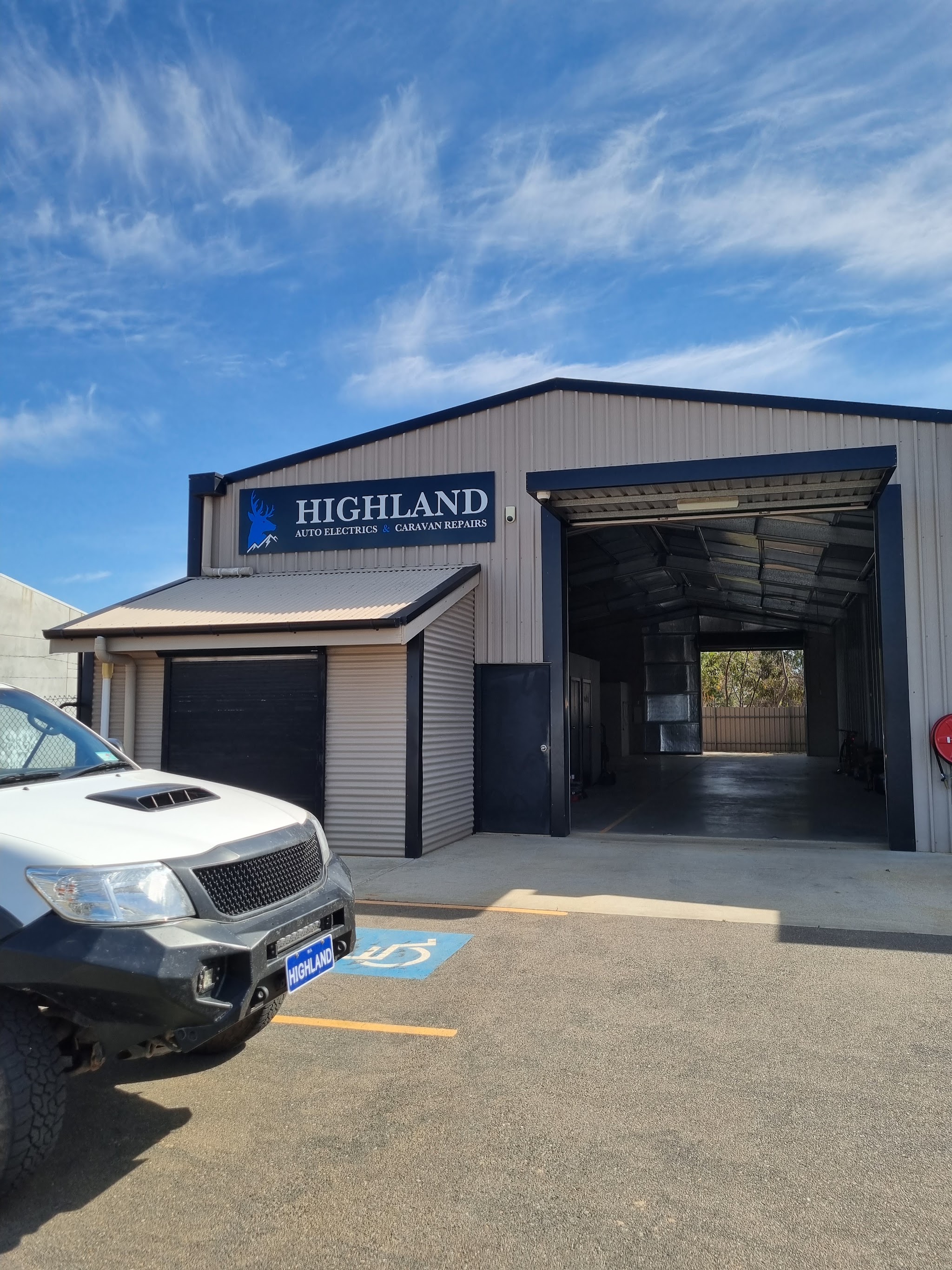 The Highland Auto Electrics & Caravan Repairs workshop on Theen Ave, Willaston, with the drive-through bay open
